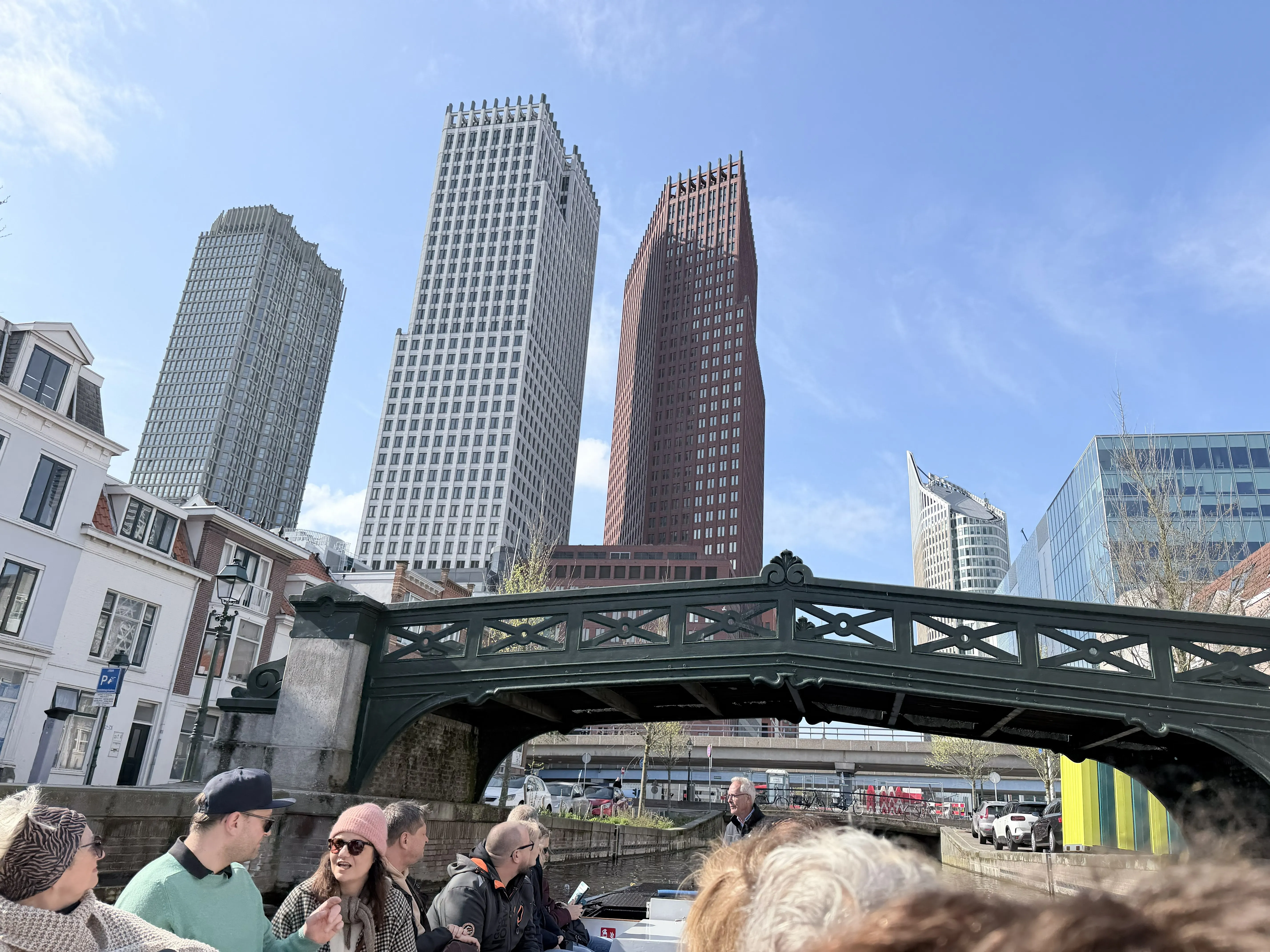 We were extremely lucky with the weather as well. The bridge seen here is an exception in how high it rises over the canal. The Hague's skyline as seen from a boat