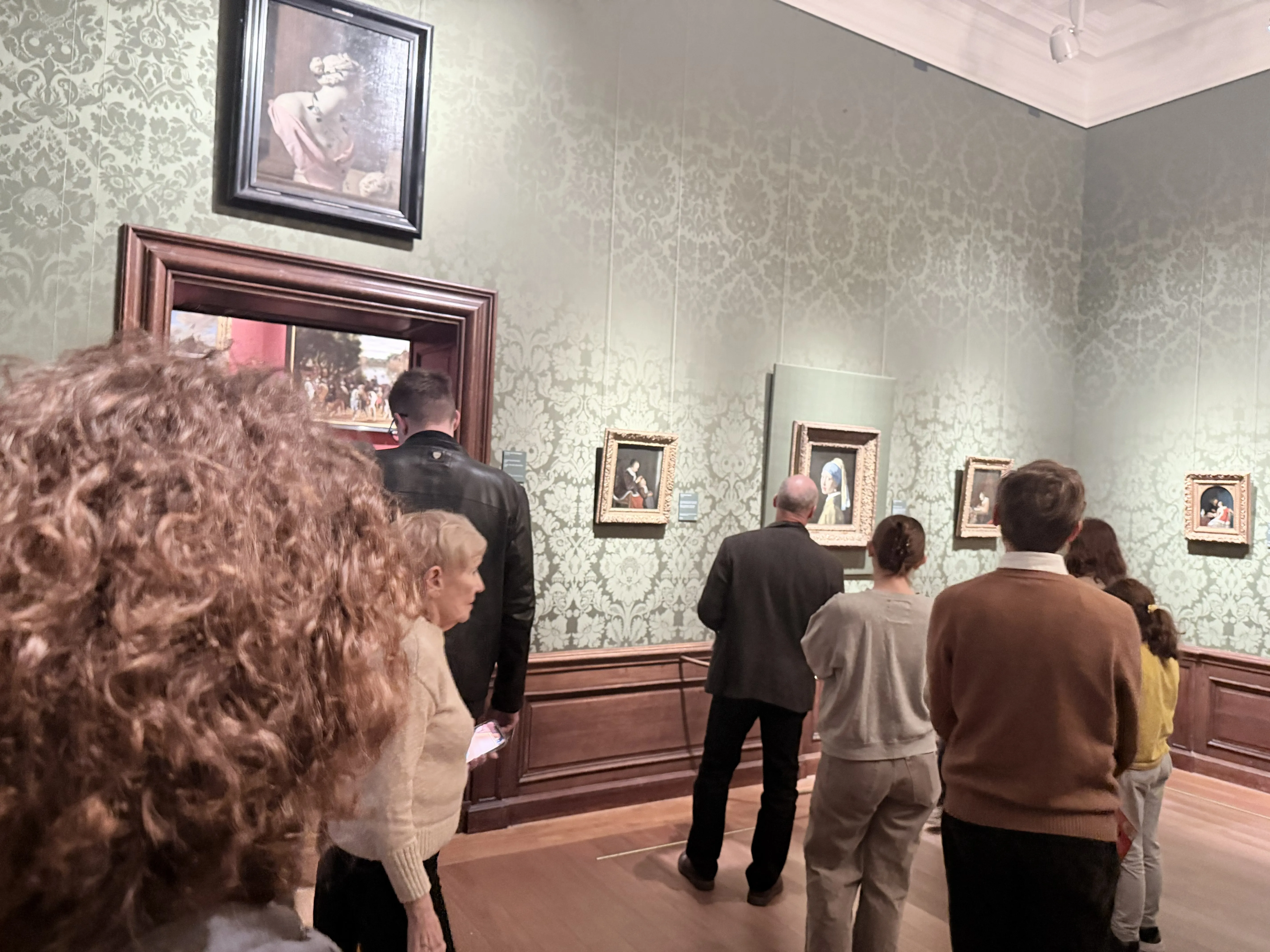 An impromptu line was forming in front of the Girl with a Pearl Earring for people to take photos. The museum attendants had to disband it while being quite annoyed. The most famous painting inside Mauritshuis somewhere in the background