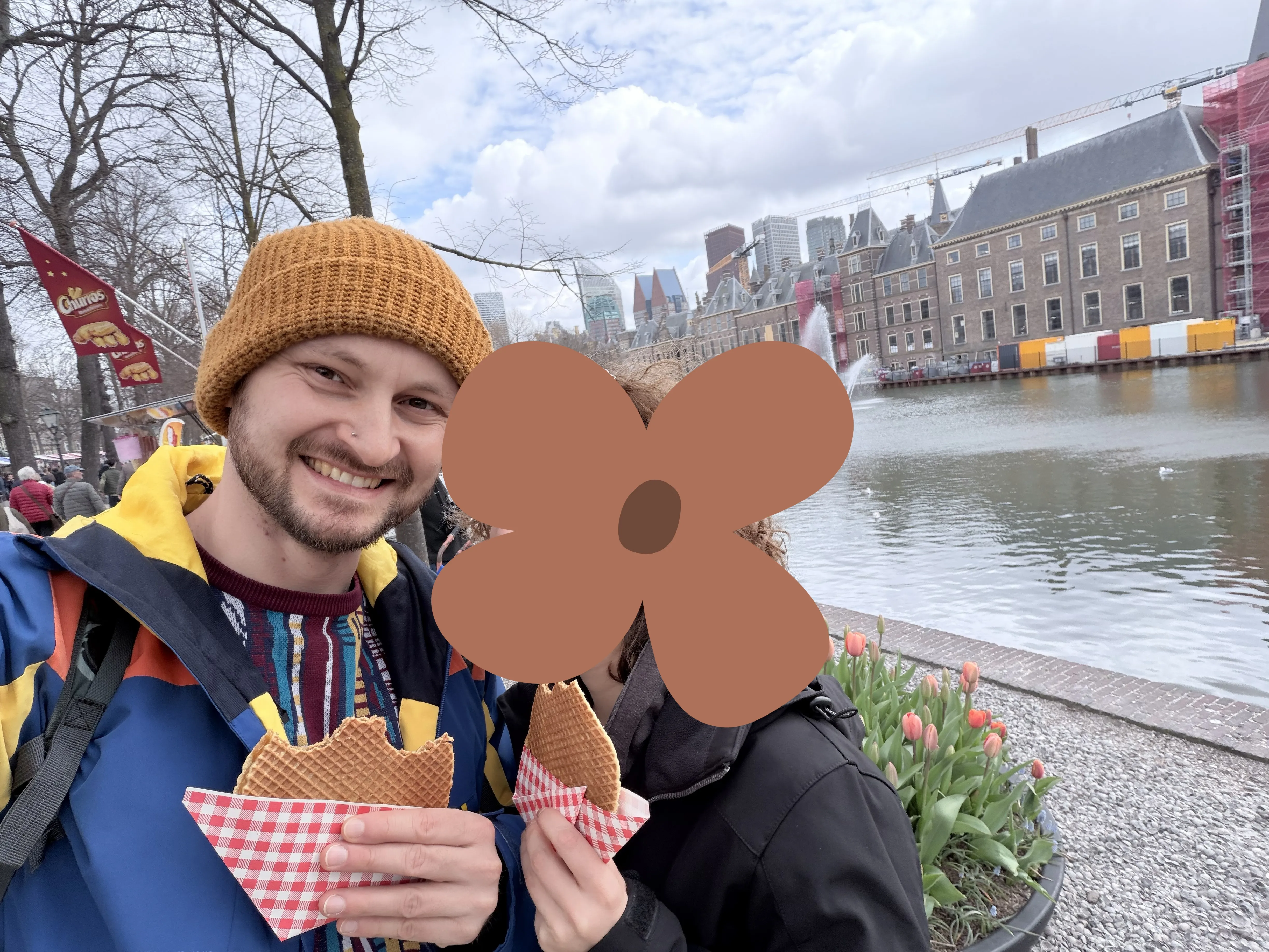 Stroopwafels freshly prepared in a waffle iron, manually cut in half, and having caramel sauce spread on it sure is different from the store-bought options. Me and a two-legged brown flower enjoying Stroopwafels